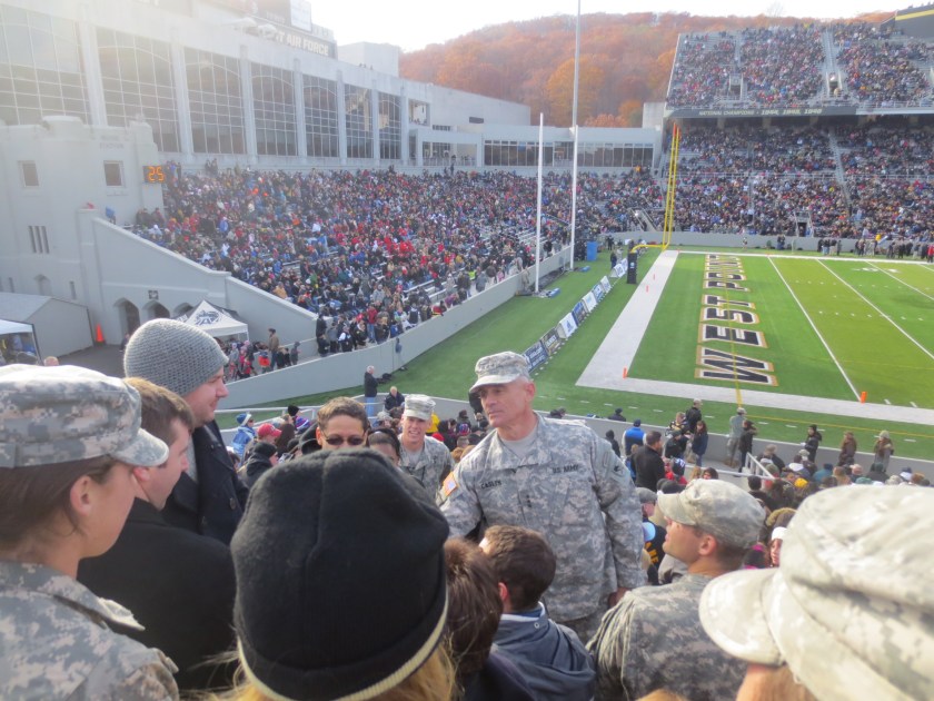 Lieutenant General Robert Caslen, the Superintendent of West Point, shaking the hand of a veteran in the stands at the Army-Western Kentucky game, Saturday 9 November 2013.