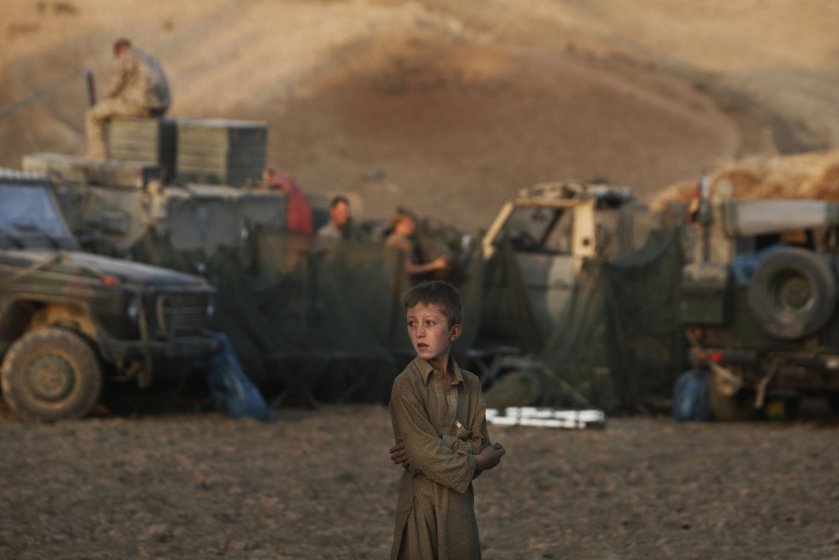 Anja Niedringhaus, An Afghan Boy with German troops, near Kunduz, September 2009