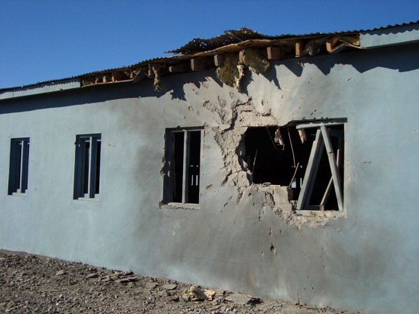 A Camp Clark "B-hut" after being hit by a 107mm rocket fired by insurgents in Khost province, Afghanistan, 2008.