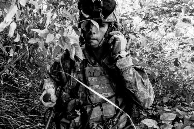 Soldier with mine detector, Iraq, 2005, by Bill Putnam. 